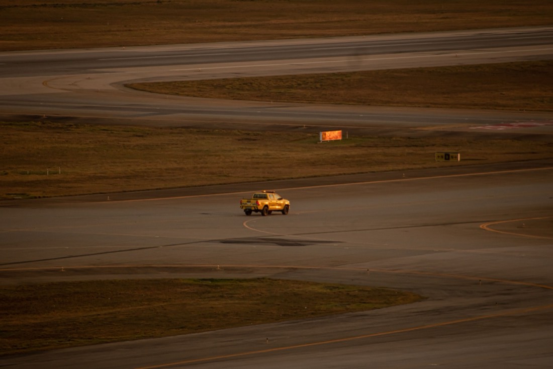 Airside operations vehicle crossing a taxiway